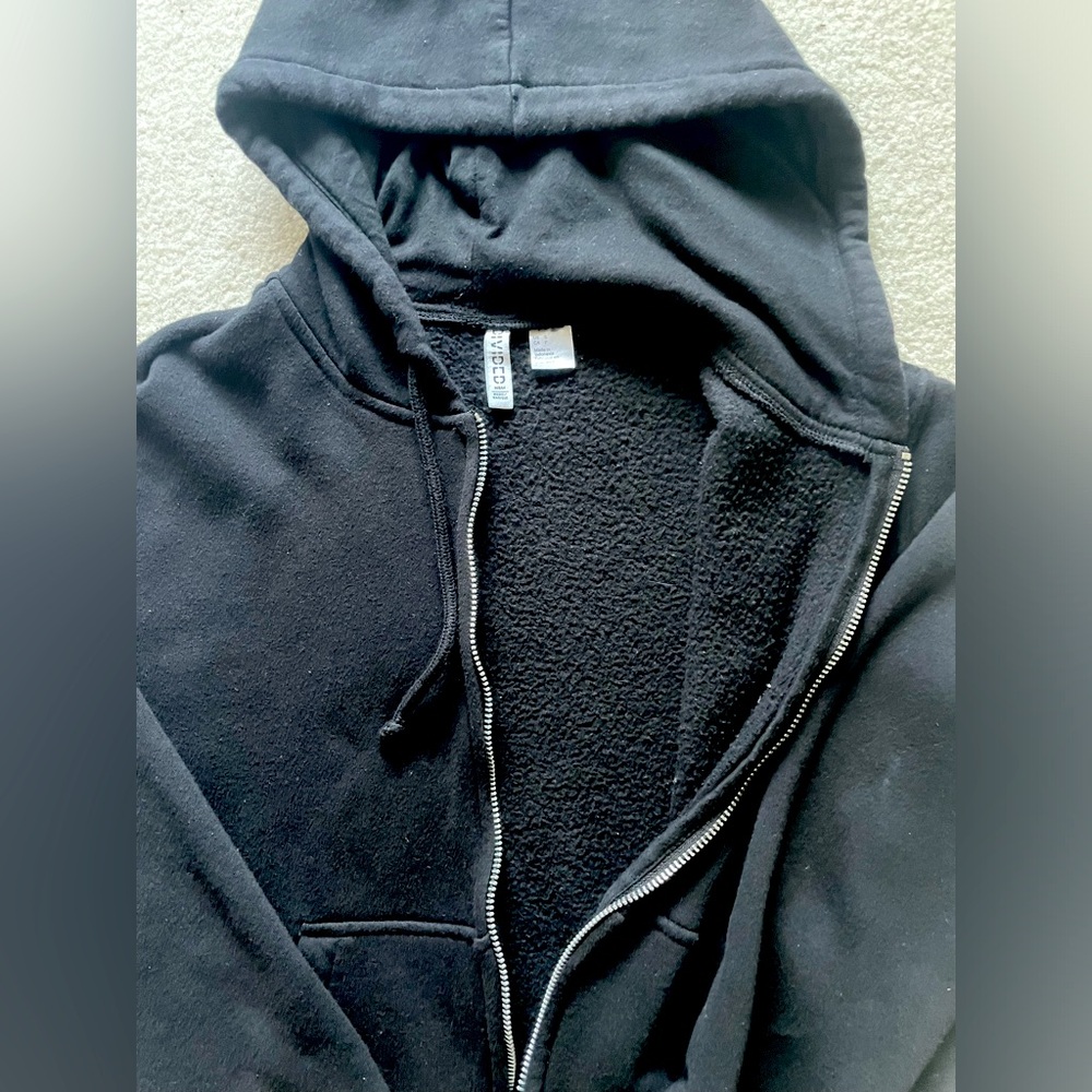 H&M women’s black fleece zip up sweater.